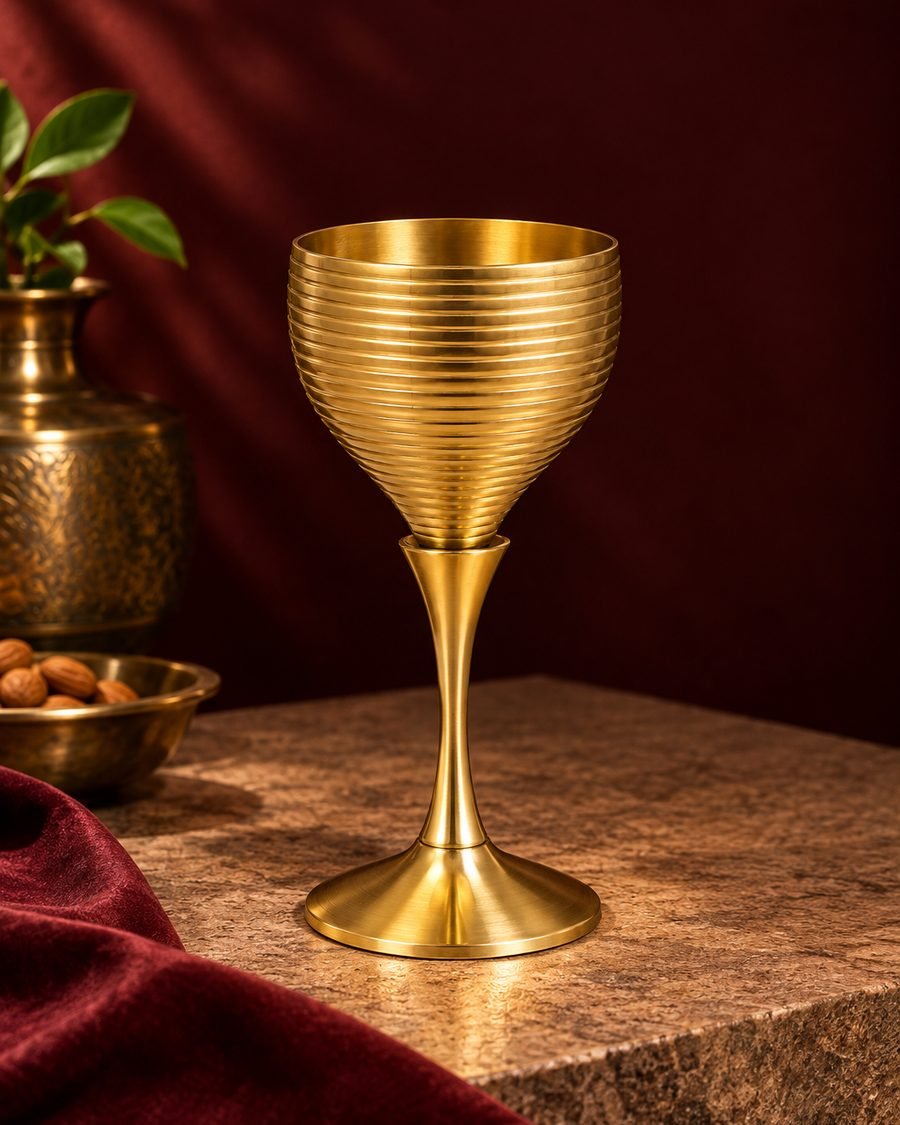Ribbed brass wine goblet in matt gold finish, a corporate gifting choice